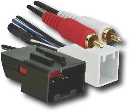 Ford radio harness adapter connected to a vehicle's wiring system