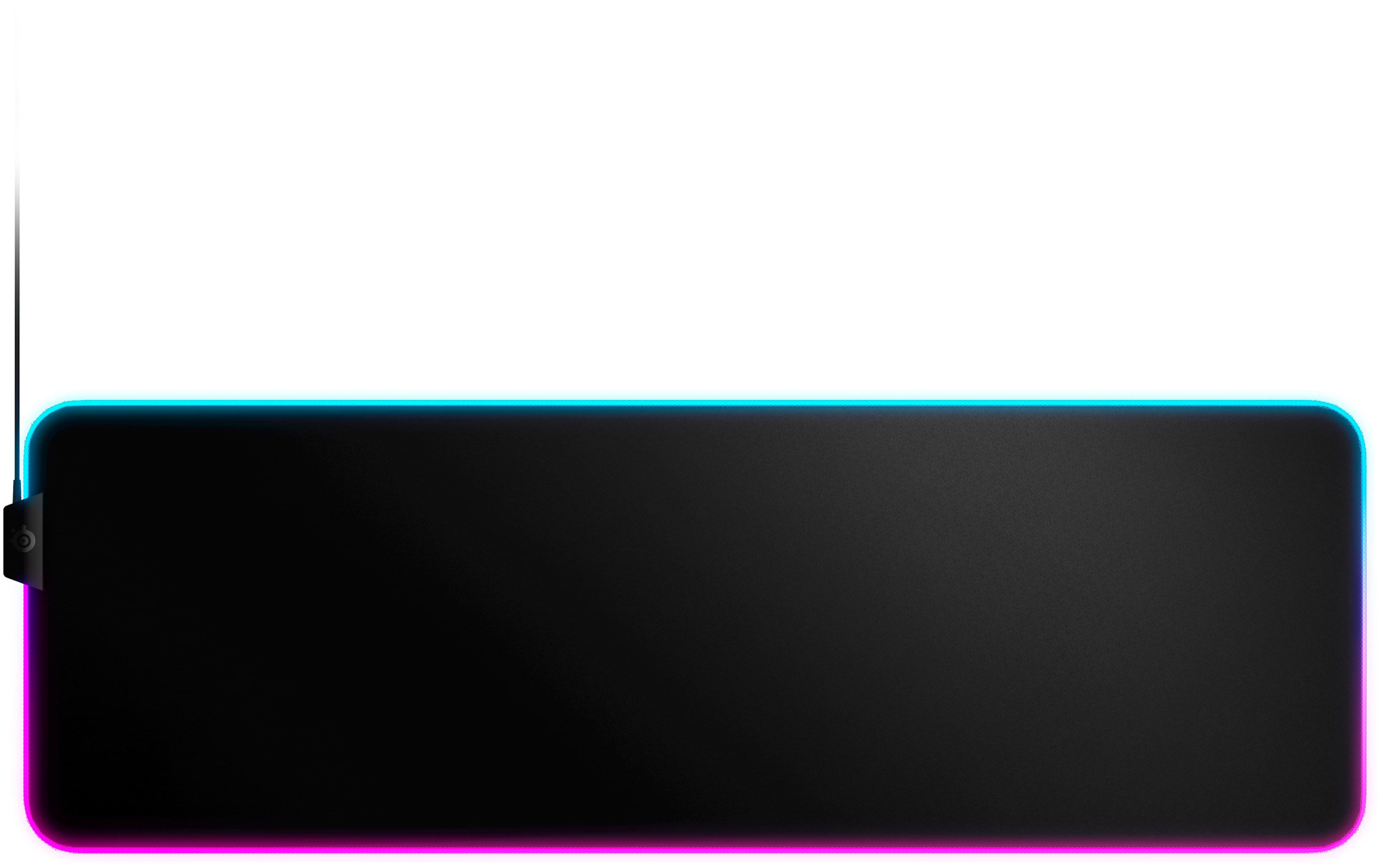 SteelSeries QcK Prism mouse pad with RGB lighting on a gaming desk